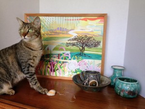 A rescue kitty among her locally made wares from High Fire Hawaii